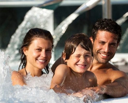 Family enjoying the facilities at Garda Thermae Spa near Lake Garda.