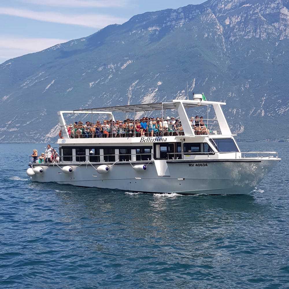 A boat with a group excursion on board on Lake Garda.